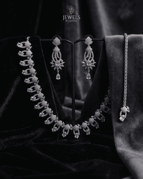 "Silver white AD scalloped necklace set with earrings and bracelet on grey velvet by Jewels by Sarah"