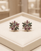 22K gold plated multi color stone stud earrings on beige jewelry box