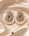 Pair of luxury gold-plated Zircon chandbali earrings with white pearls on a gold silk background.