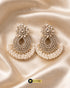 Pair of luxury gold-plated Zircon chandbali earrings with white pearls on a gold silk background.