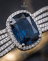 Close-up of sapphire blue center stone with pave zircon halo – Jewels by Sarah