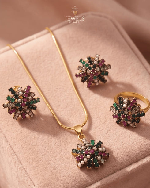 "Multicolor gemstone starburst necklace set with earrings and ring on pink velvet by Jewels by Sarah"