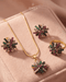 "Multicolor gemstone starburst necklace set with earrings and ring on pink velvet by Jewels by Sarah"