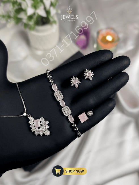 Elegant rose pink zircon ring and bracelet set for university or office wear.