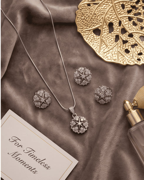 Silver zircon starburst necklace and earrings set styled with gold decor – Jewels by Sarah