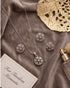 Silver zircon starburst necklace and earrings set styled with gold decor – Jewels by Sarah