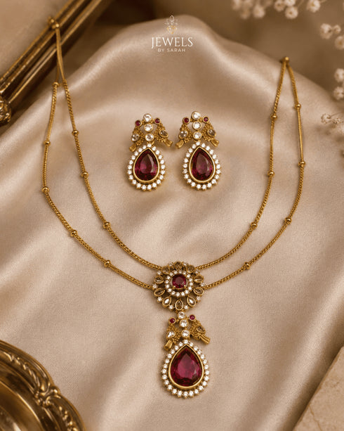 South Indian layered necklace set with ruby drop pendant and earrings on satin fabric - Jewels by Sarah Signature Collection