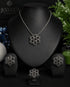 The complete luxury midnight black signature collection suite featuring the necklace, earrings, and ring arranged on a professional black jewelry display stand
