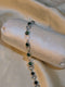 Silver Plated Bracelet with Alternating Round Emerald Green Zircons and Open Heart Links - Artificial Jewellery Pakistan