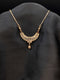 Rose gold filigree crescent necklace with white cubic zirconia floral center and teardrop stone dangle on a dark background.