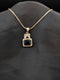Rose gold necklace featuring a rectangular midnight blue stone pendant with a crystal halo and a butterfly-shaped stone bail on a black background.