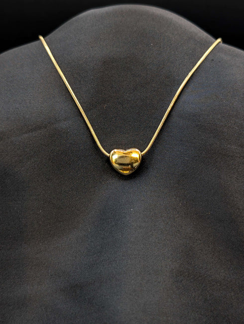 Gold-plated stainless steel puffed heart slider necklace on a tarnish-resistant snake chain.