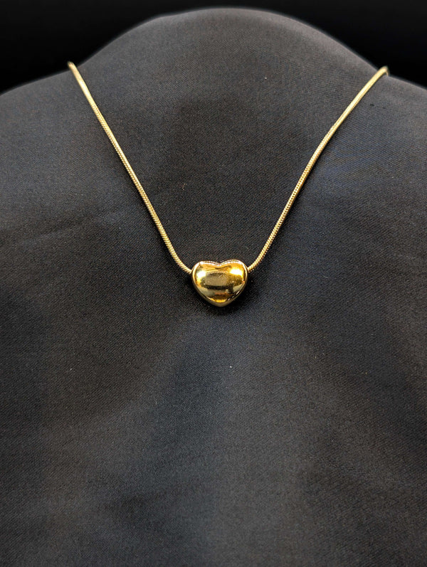 Gold-plated stainless steel puffed heart slider necklace on a tarnish-resistant snake chain.