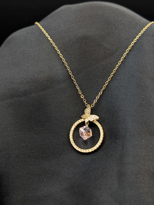 Gold-plated stainless steel necklace featuring a circular pave halo pendant with a butterfly accent and a floating crystal cube center.