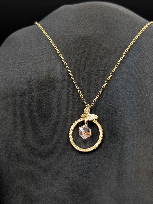 Gold-plated stainless steel necklace featuring a circular pave halo pendant with a butterfly accent and a floating crystal cube center.