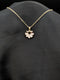 Gold-plated stainless steel necklace with a fan-shaped sunburst pendant featuring pear-cut crystals on a black background.