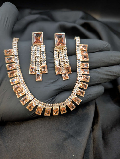 Close-up of a Gold Champagne 1 Karat Zircon necklace and earring set for romantic styling.