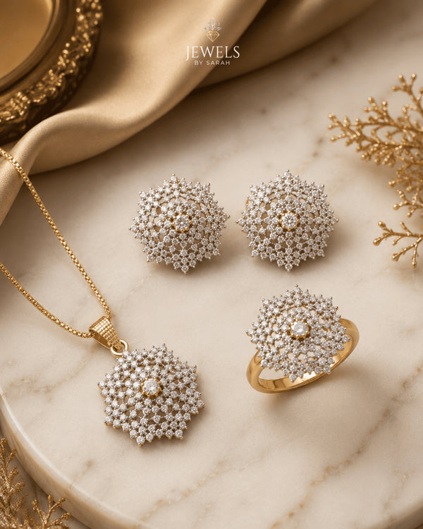 "22K gold polish jurao stone snowflake necklace set with earrings and ring on marble by Jewels by Sarah"