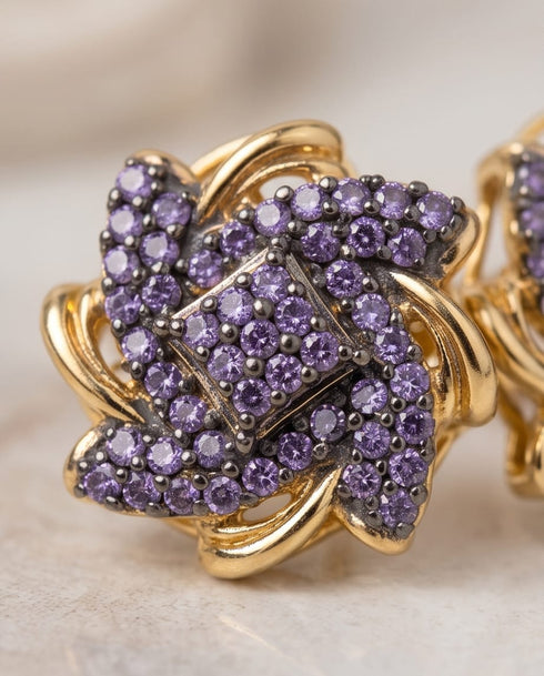 Close up of purple stone floral stud earring design detail