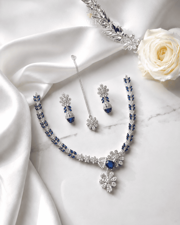 "Royal blue AD bridal necklace set with tikka and earrings on white satin by Jewels by Sarah"