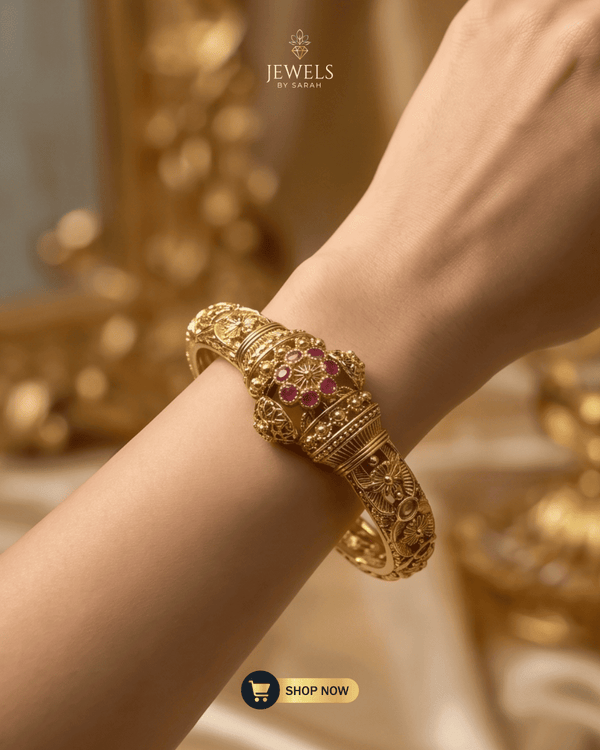 Model wearing the Floral Ruby Signature Bangle from Jewels by Sarah.